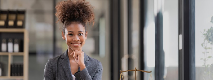 Female lawyer sitting at workplace in office