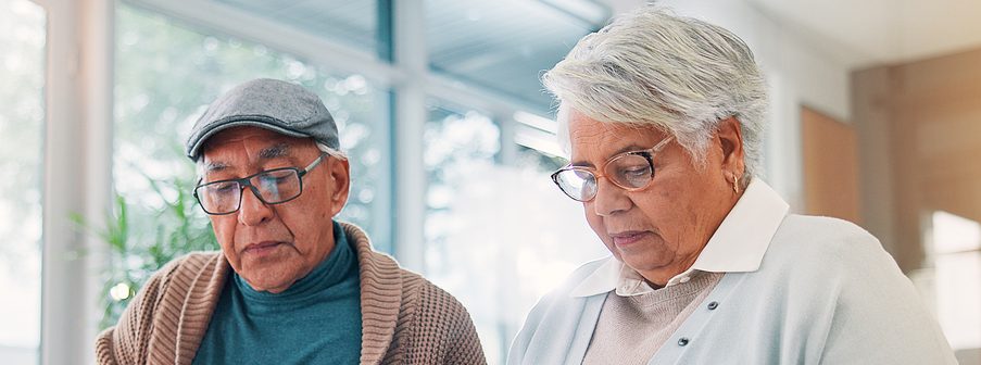 Senior couple, tablet and clipboard at house for finance planning, review bills and payment checklist. Elderly people, digital and document for investment, insurance application and asset management